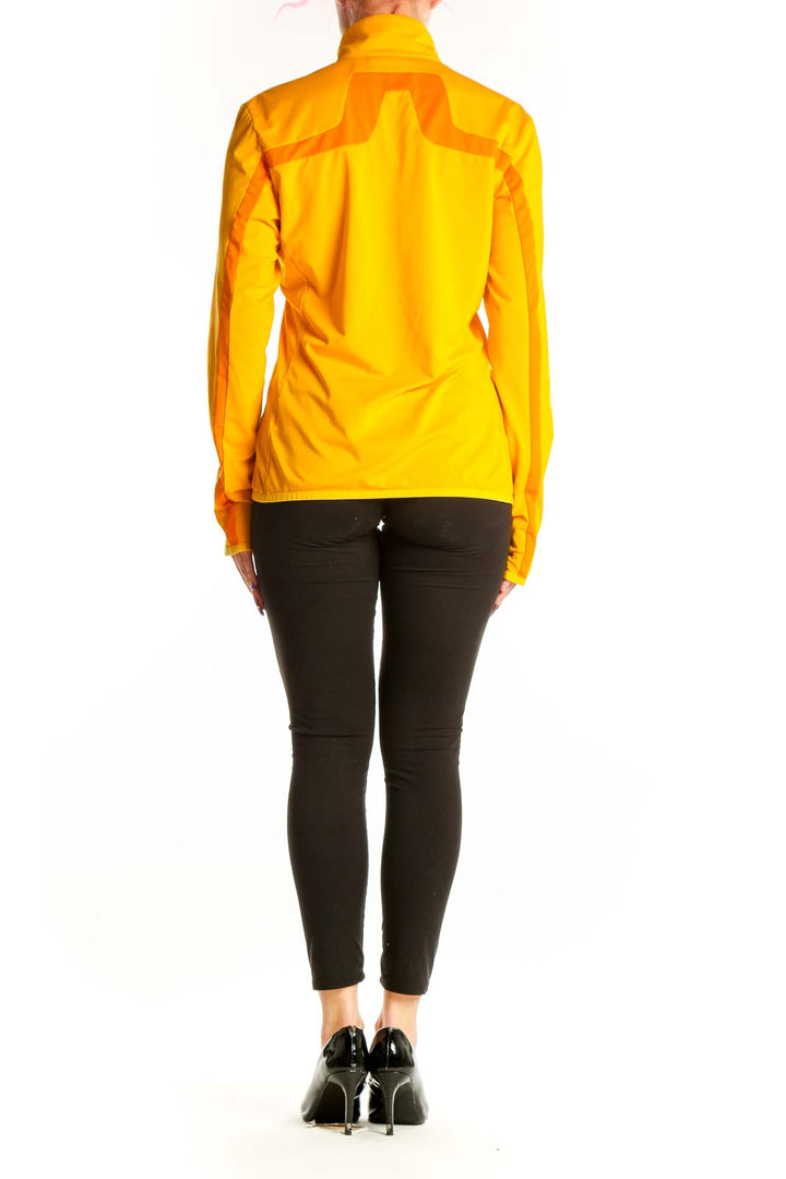 Back view of yellow J. Lindbergh windbreaker jacket showing color-block design and fitted silhouette