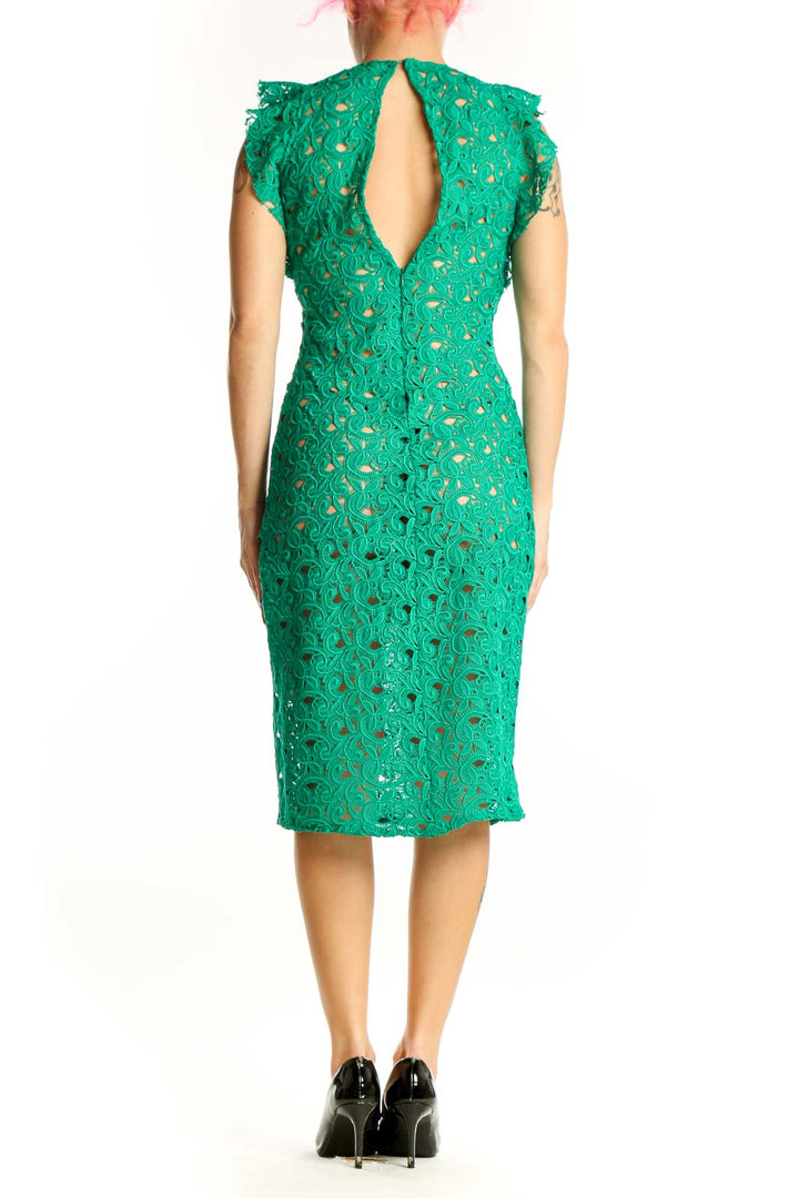 Back view of green lace midi dress showing ruffle shoulder detail and elegant lace construction