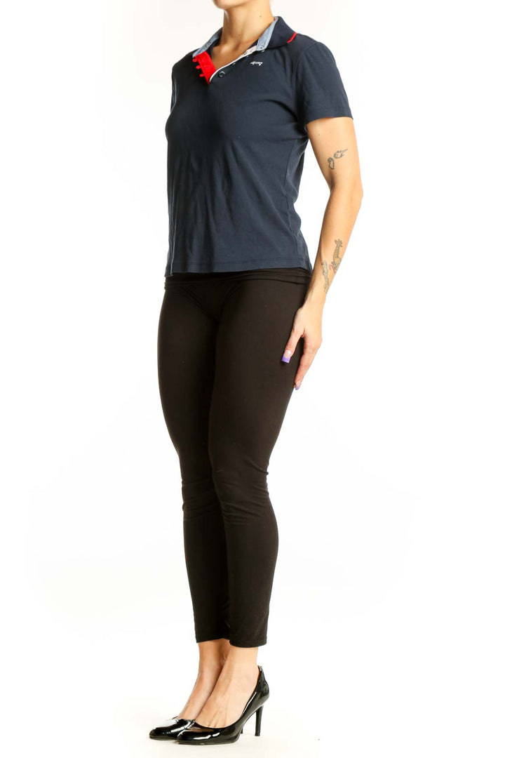 Navy cotton polo shirt with red and gray contrast collar by Louis Castel, front view