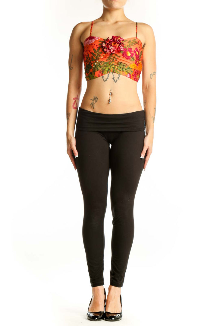 Front view of orange floral cropped camisole top by Joie with tropical print