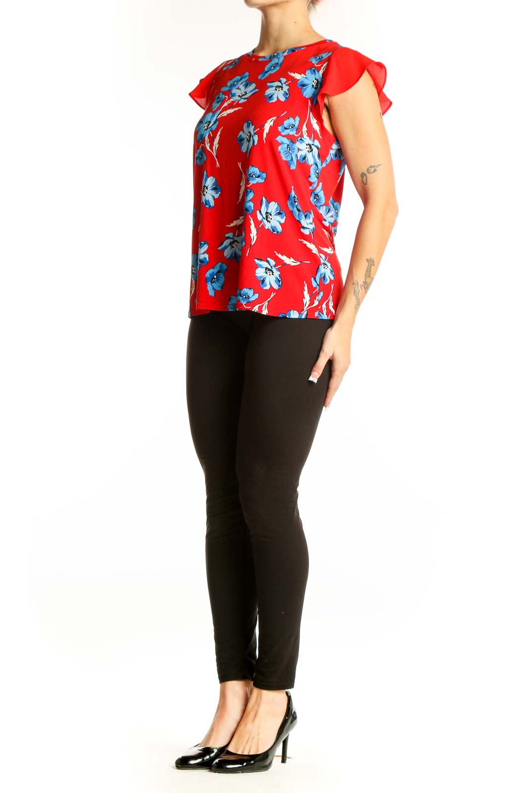Front view of red CeCe blouse with blue floral print and flutter sleeves