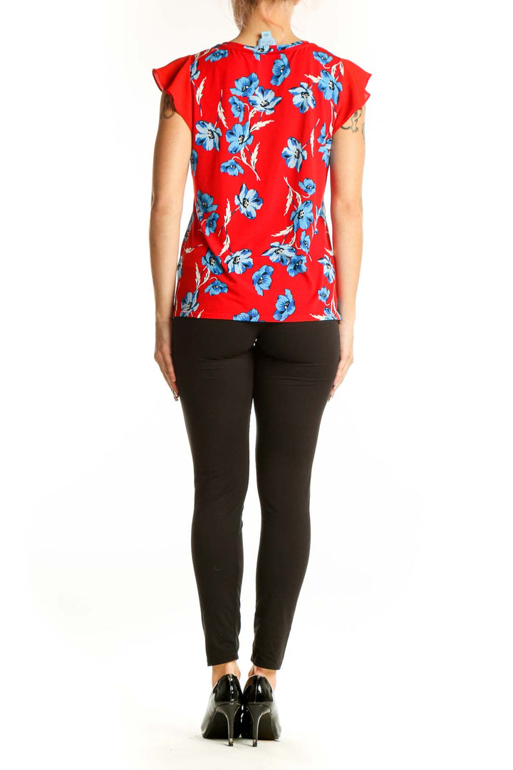 Back view of red CeCe blouse with blue floral print and flutter sleeves