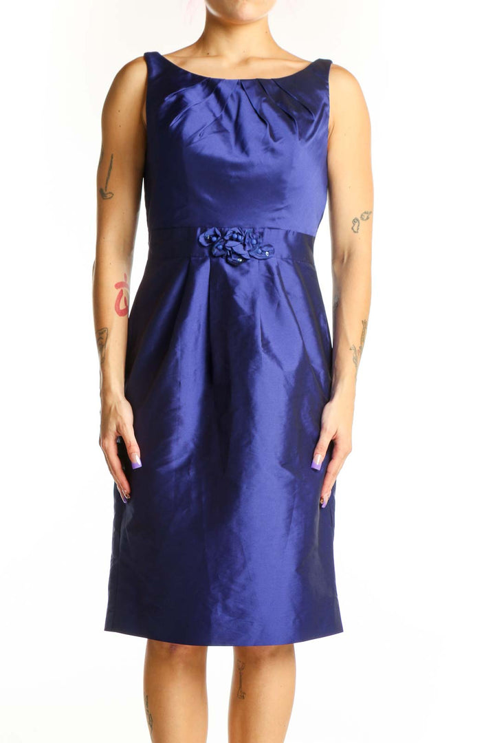 Navy blue satin cocktail dress with ruched neckline and embellished waist detail, front view