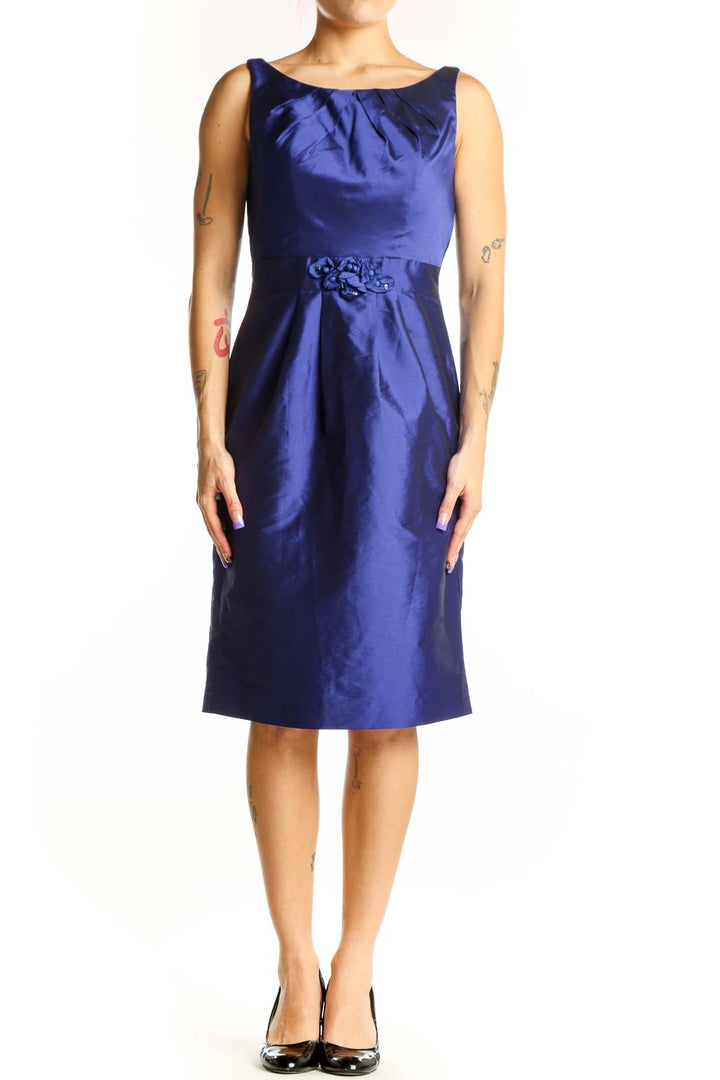 Navy blue satin cocktail dress with ruched neckline and embellished waist detail, front view