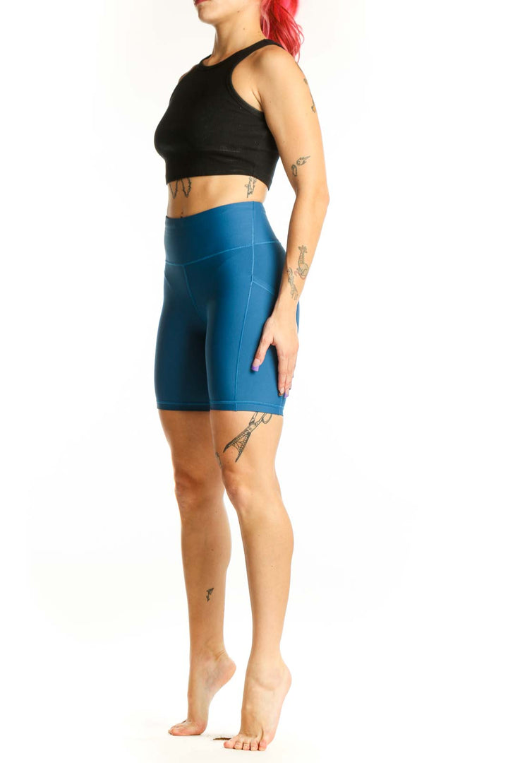 Front view of Athleta Blue Compression Shorts XS with high-waisted design and supportive fit