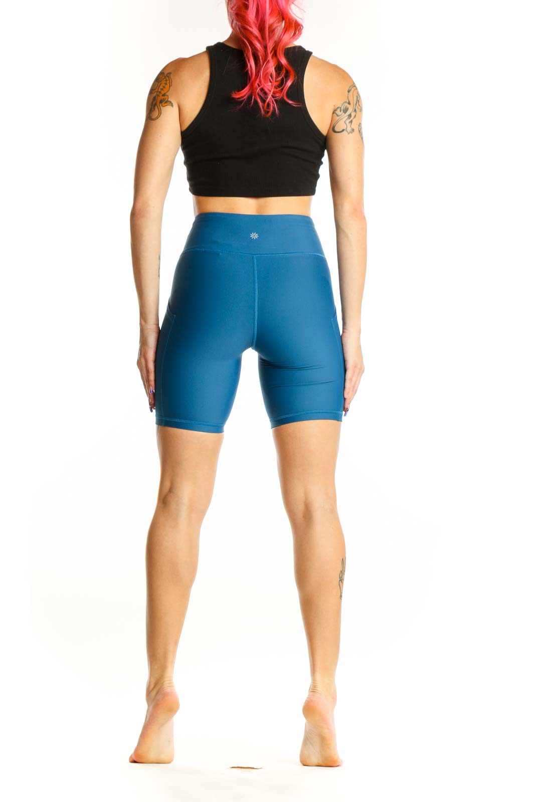 Back view of Athleta Blue Compression Shorts XS showing bike short silhouette and mid-thigh length