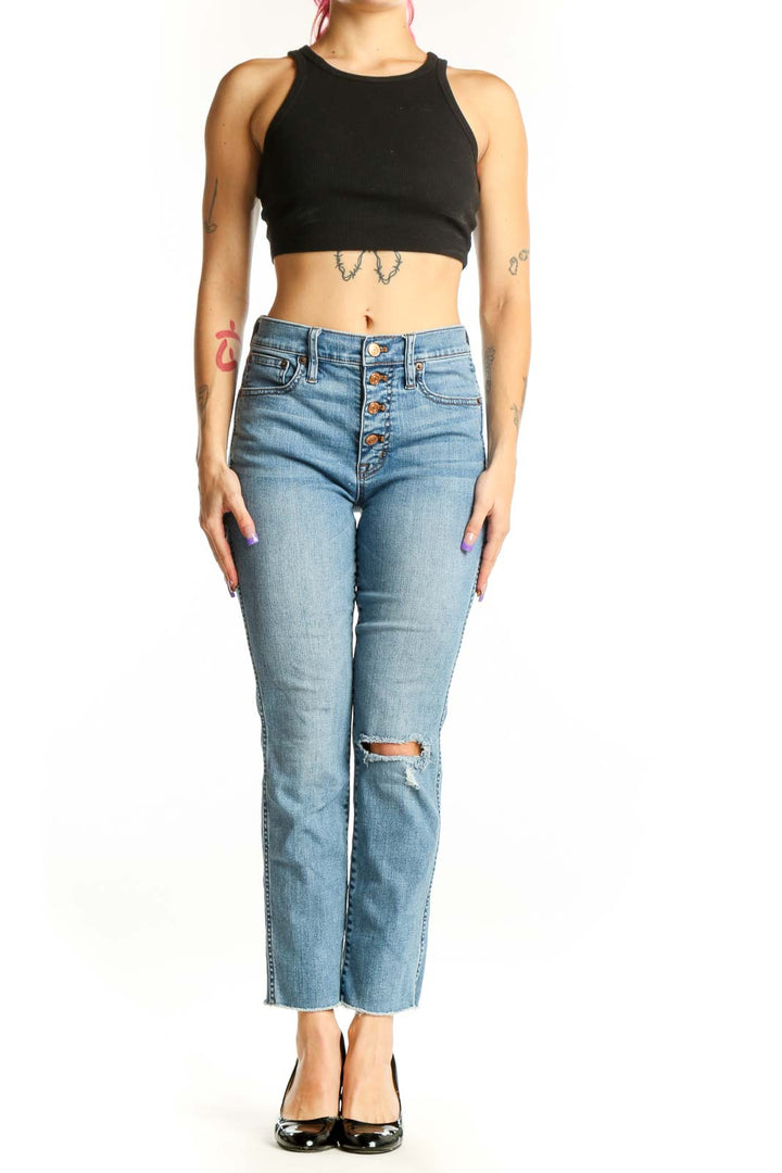 Front view of light blue J.Crew distressed cropped jeans with button-fly closure and ripped knee detail