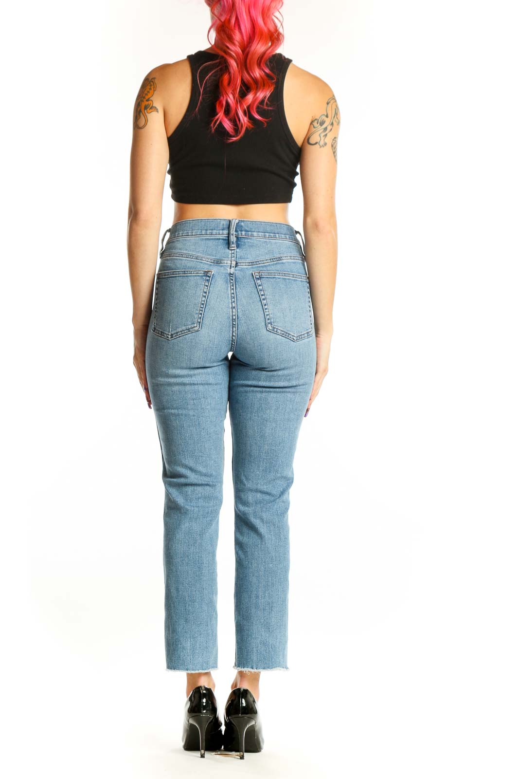 Back view of light blue J.Crew cropped jeans showing high-rise fit and distressed knee rip