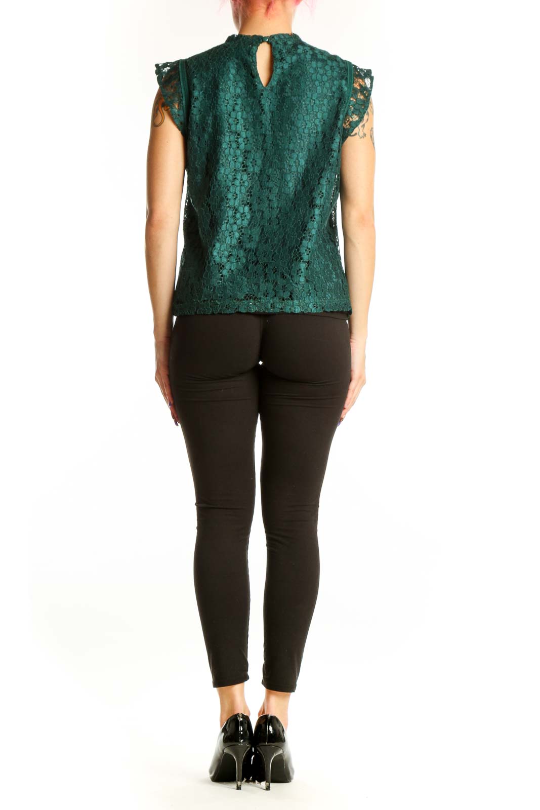 Back view of green lace sleeveless top showing lace detailing and zipper closure