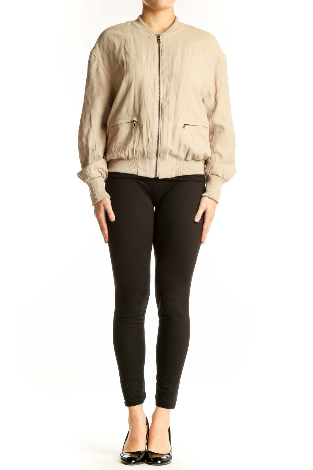 Front view of cream quilted bomber jacket with full zip closure and side pockets