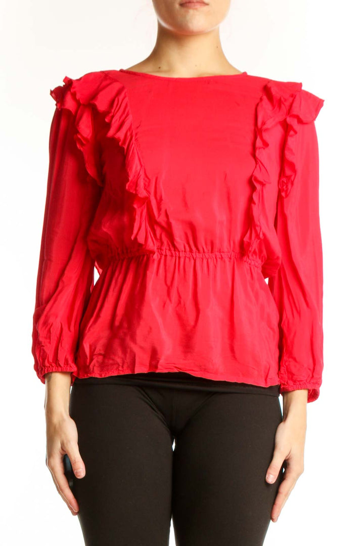 Red ruffle long sleeve viscose top with dramatic shoulder ruffles and cinched waist, front view