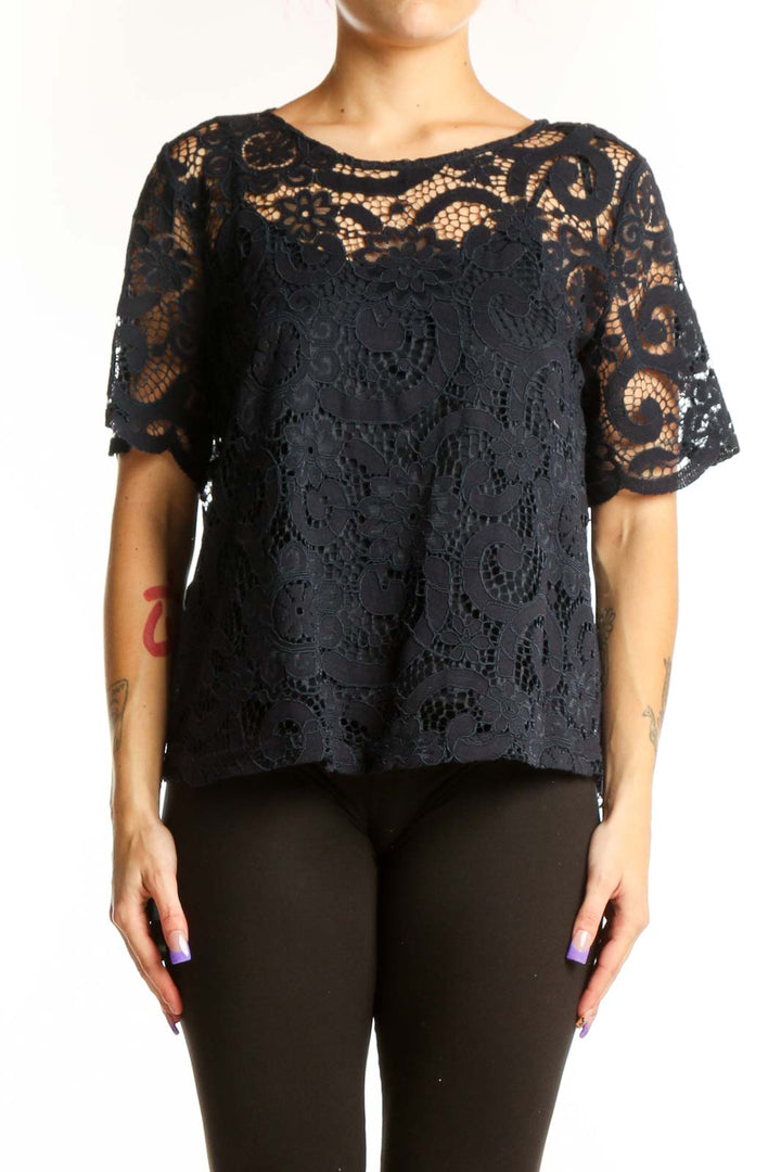 Black lace short sleeve top with intricate lace overlay and flutter sleeves, front view