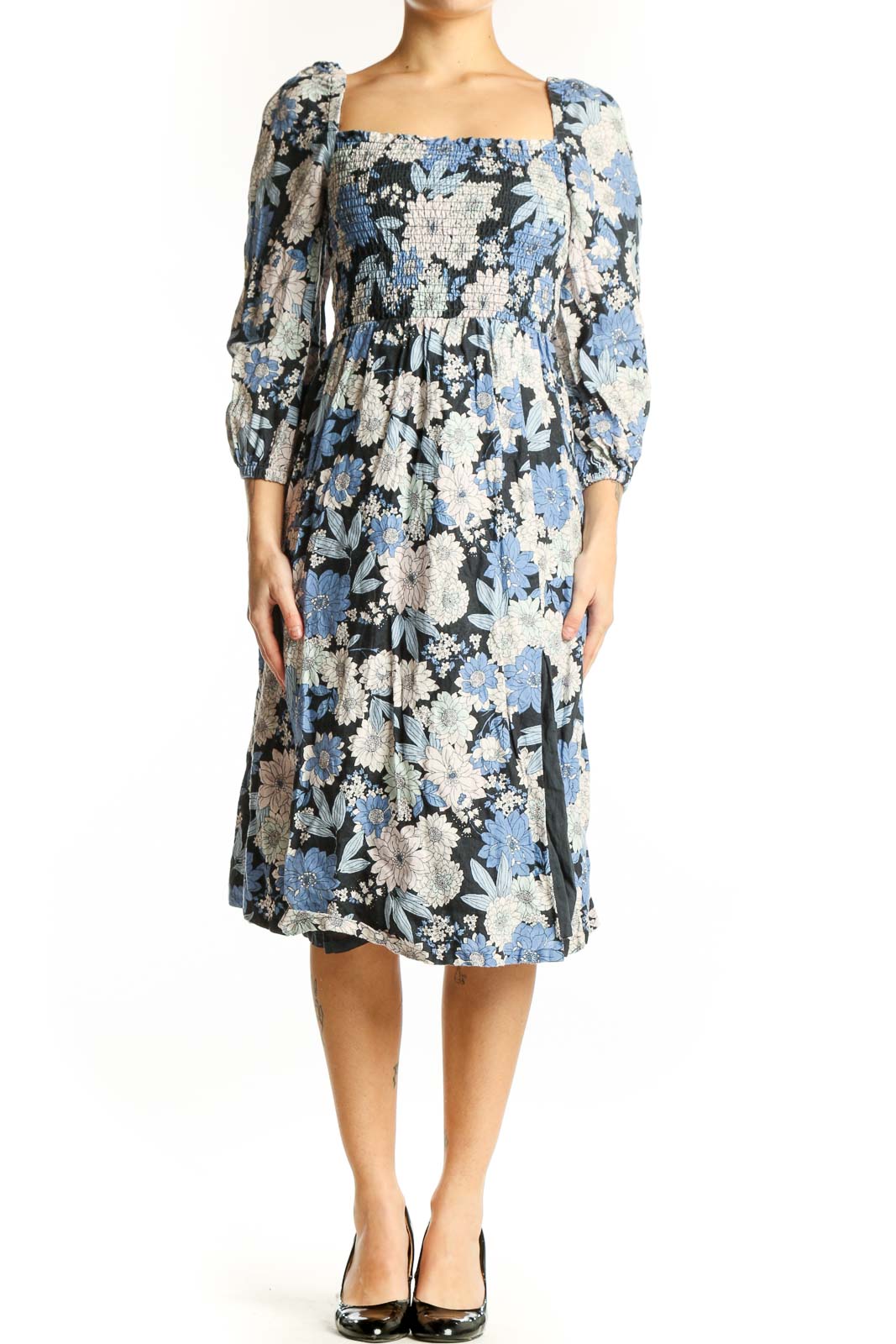 Front view of blue floral midi dress with puff sleeves and smocked square neckline