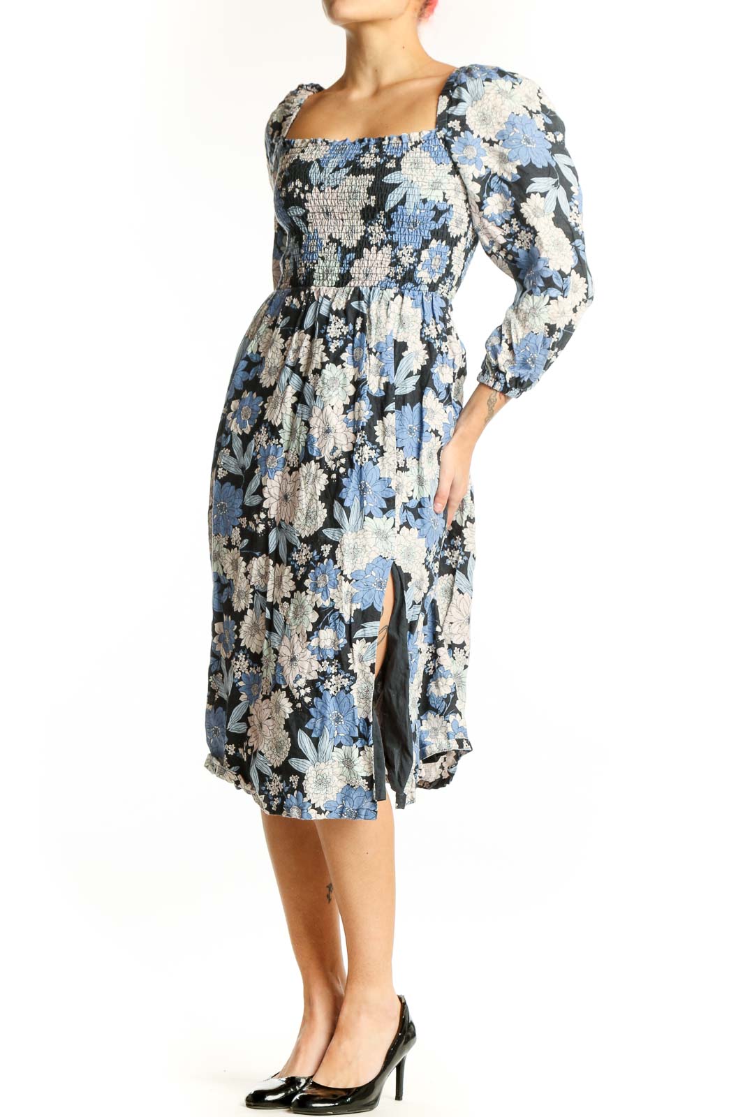 Front view of blue floral midi dress with puff sleeves and smocked square neckline