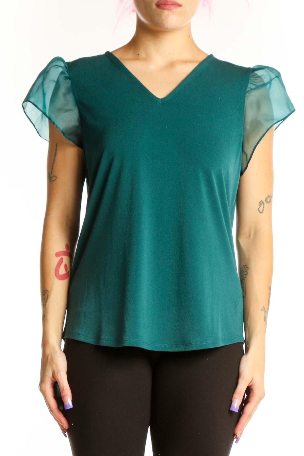 Teal puff sleeve V-neck top with sheer sleeves worn by model, front view
