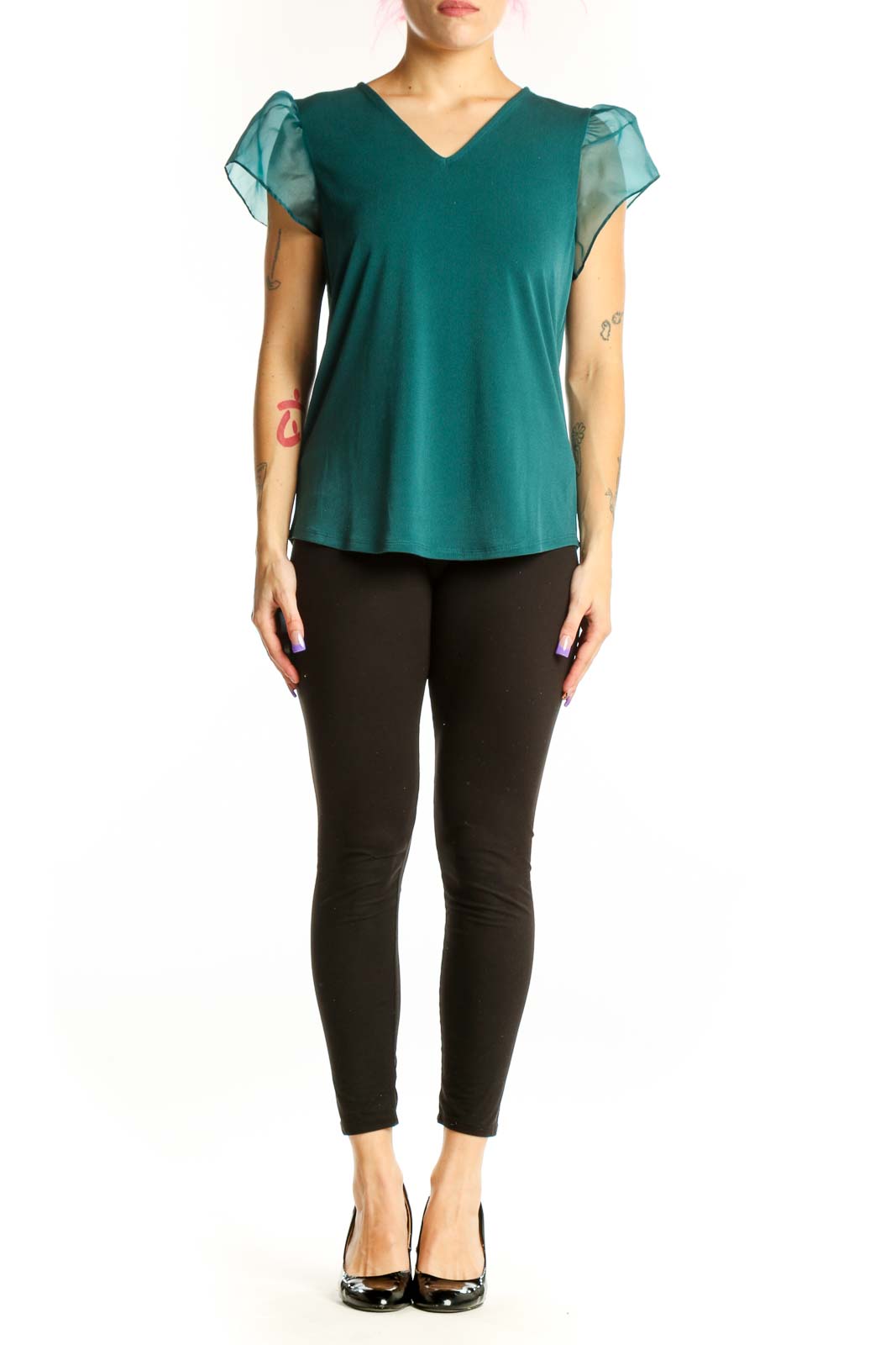 Teal puff sleeve V-neck top with sheer sleeves worn by model, front view