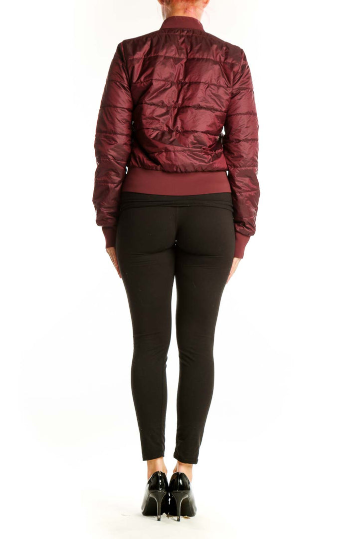Back view of burgundy Lululemon puffer jacket showing quilted design and cropped silhouette
