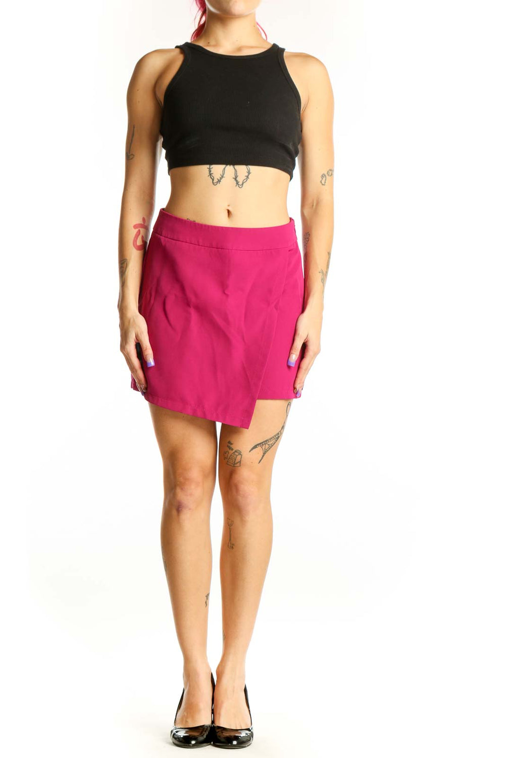 Front view of pink asymmetrical shorts with high-waisted design and stretch fabric