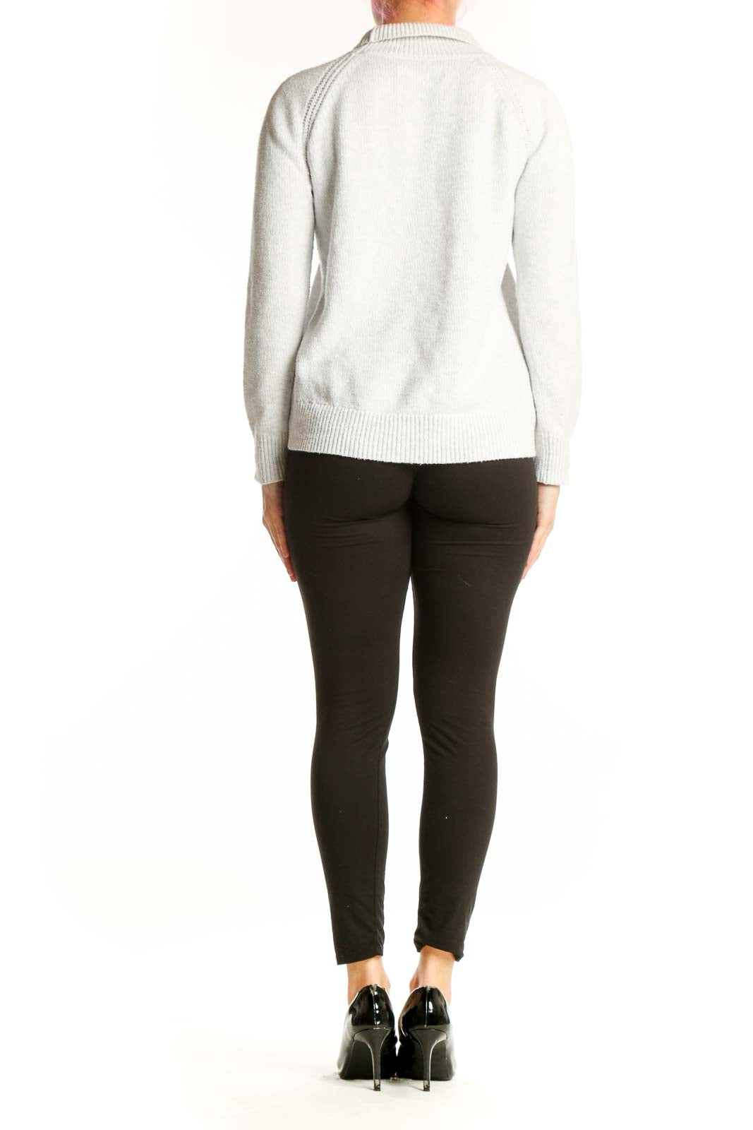 Back view of cream knit pullover sweater showing relaxed fit and cropped length