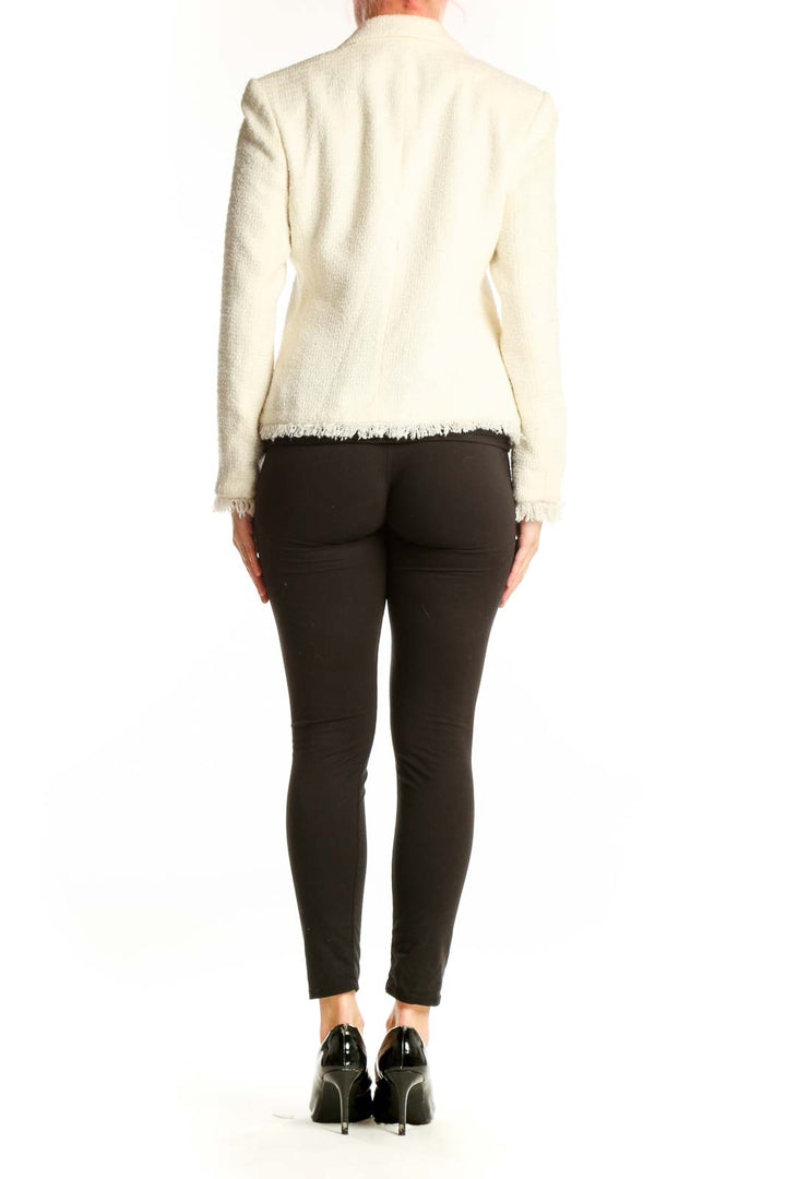 Back view of cream textured blazer with frayed cuff details by SAG HARBOR