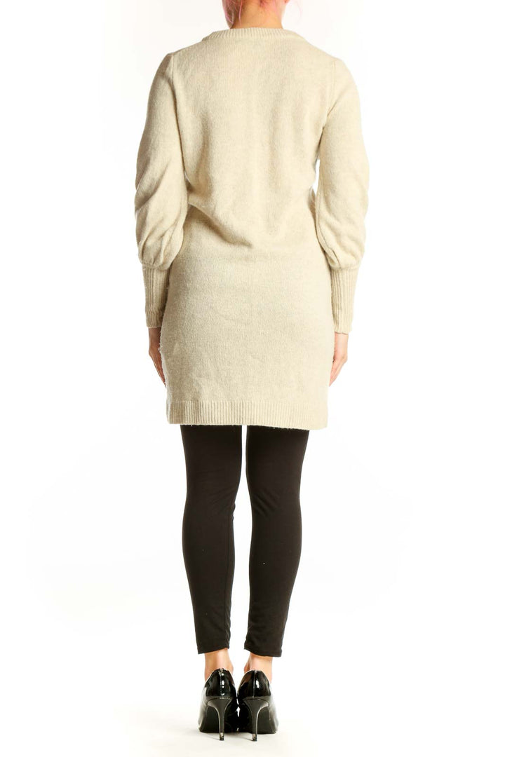 Madewell cream merino wool V-neck sweater dress with long sleeves, back view on model wearing black leggings
