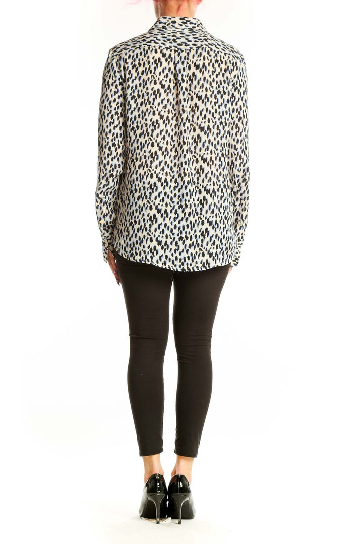 Cream and black leopard print button-up blouse with long sleeves, back view showing relaxed fit