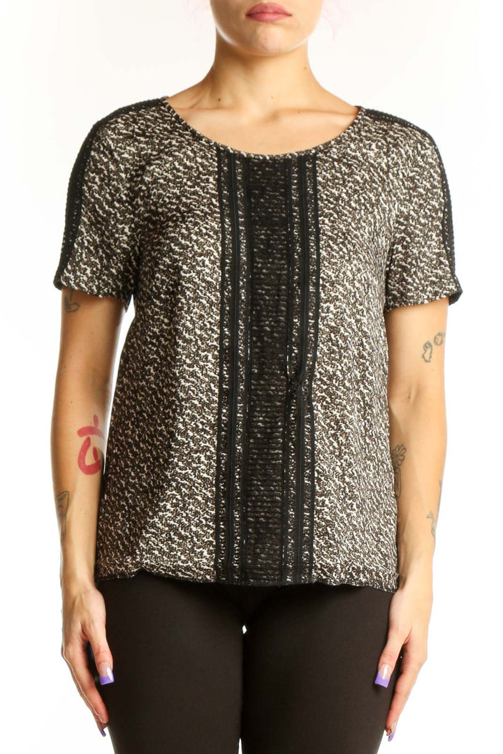 Ann Taylor black metallic short-sleeve top with gold threading and textured center panel, front view