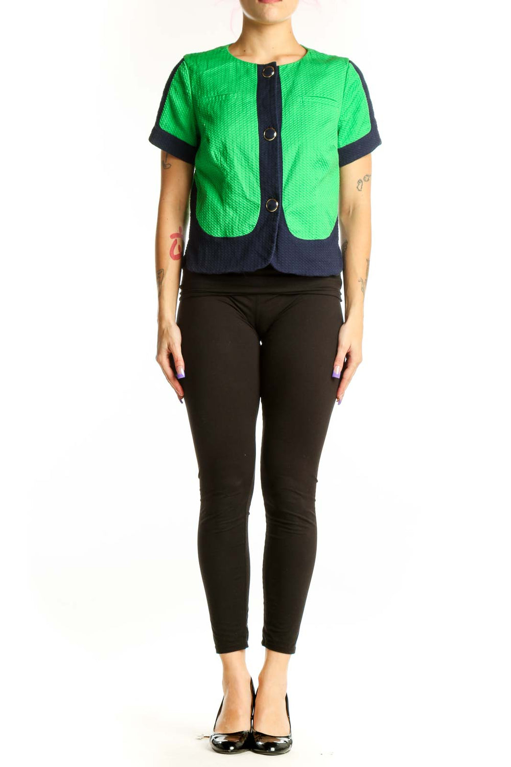 Front view of green and navy color-block quilted short-sleeve jacket by Laundry with button-front closure
