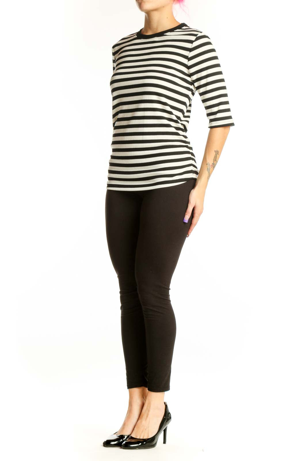 Black and white horizontally striped three-quarter sleeve top by Sanctuary, front view on model