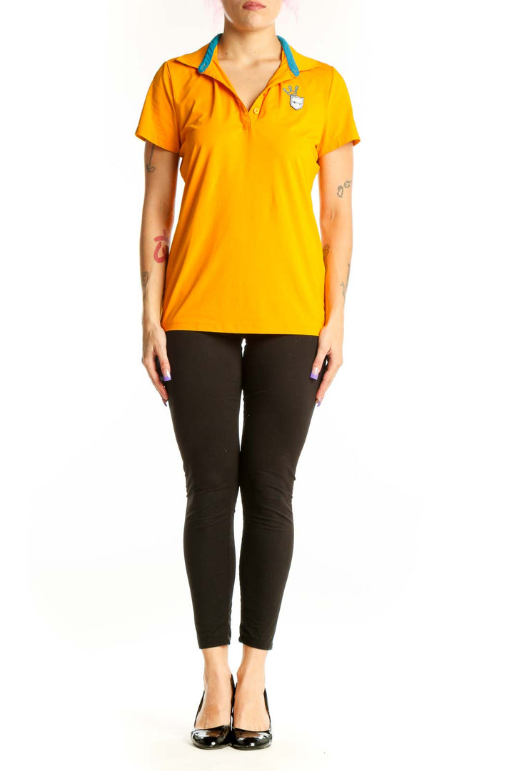 Yellow short sleeve polo top with blue contrast collar by Louis Castel, front view on model