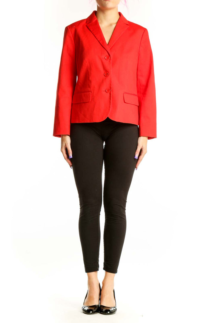 Red classic blazer jacket with notch lapel and three-button front, worn with black pants