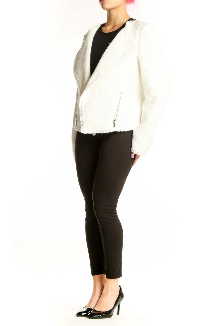 Cream textured blazer with notch lapels and frayed hem worn over black top, front view