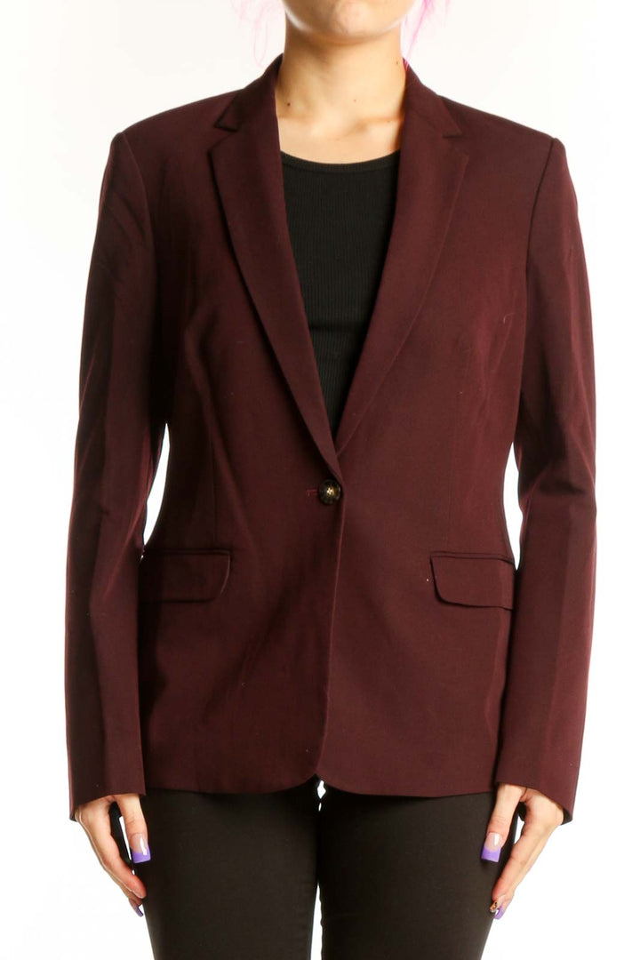 Burgundy single-button tailored blazer by Tahari worn with black top, front view