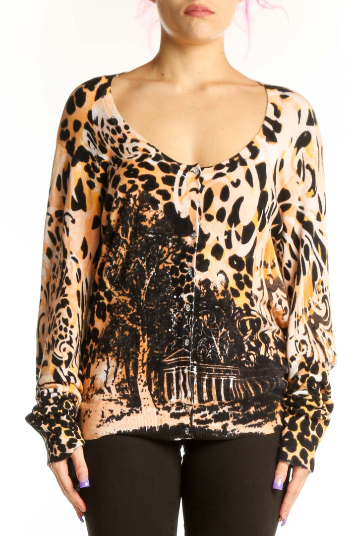 Beige and black leopard print silk blouse with graphic architectural design, V-neckline, and long sleeves