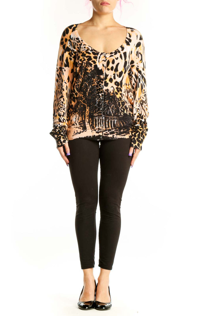 Beige and black leopard print silk blouse with graphic architectural design, V-neckline, and long sleeves