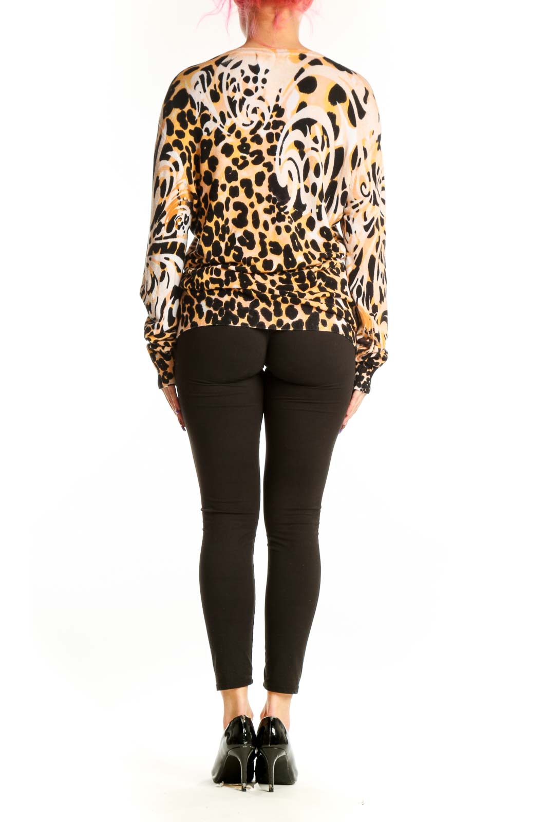 Back view of beige leopard print blouse showing artistic graphic print and long sleeve design