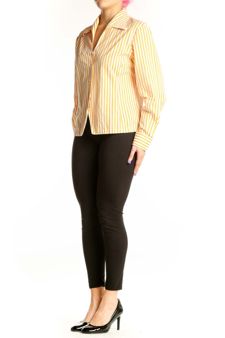 Yellow and white striped button-up blouse with structured collar and long sleeves, front view