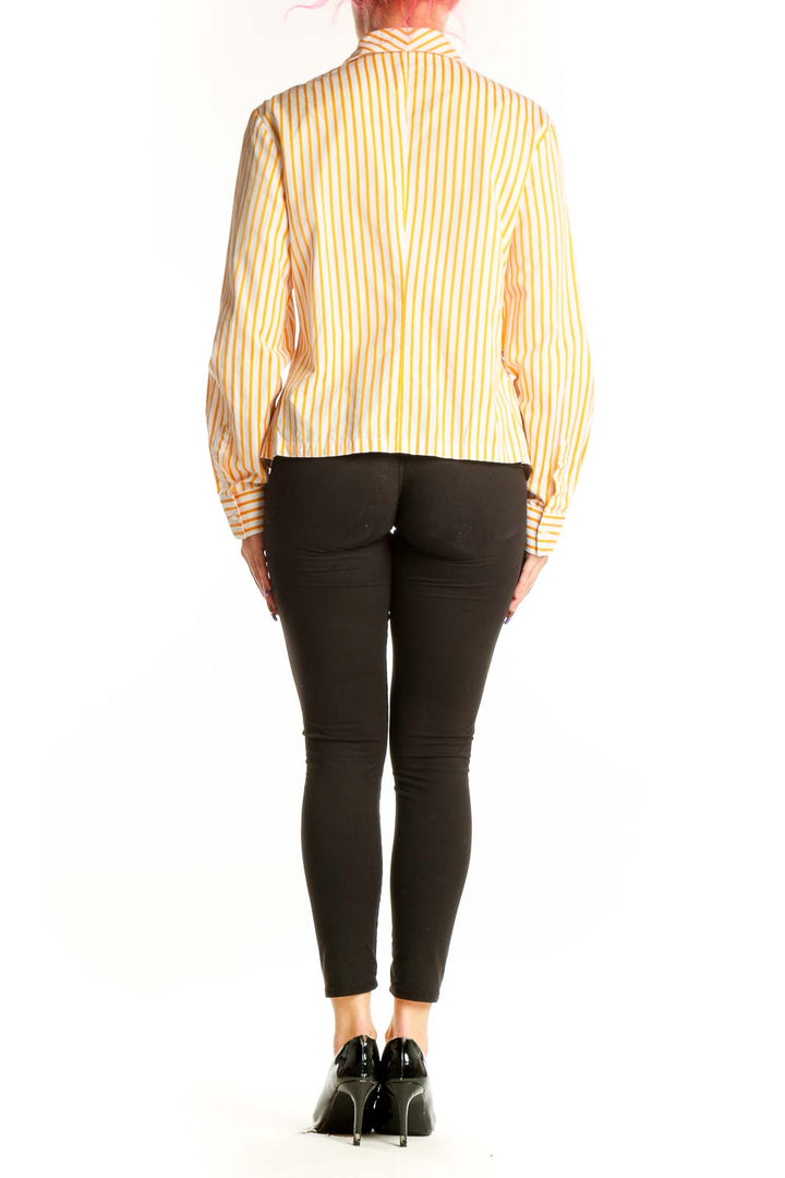 Yellow and white striped button-up blouse back view showing fitted silhouette and collar detail