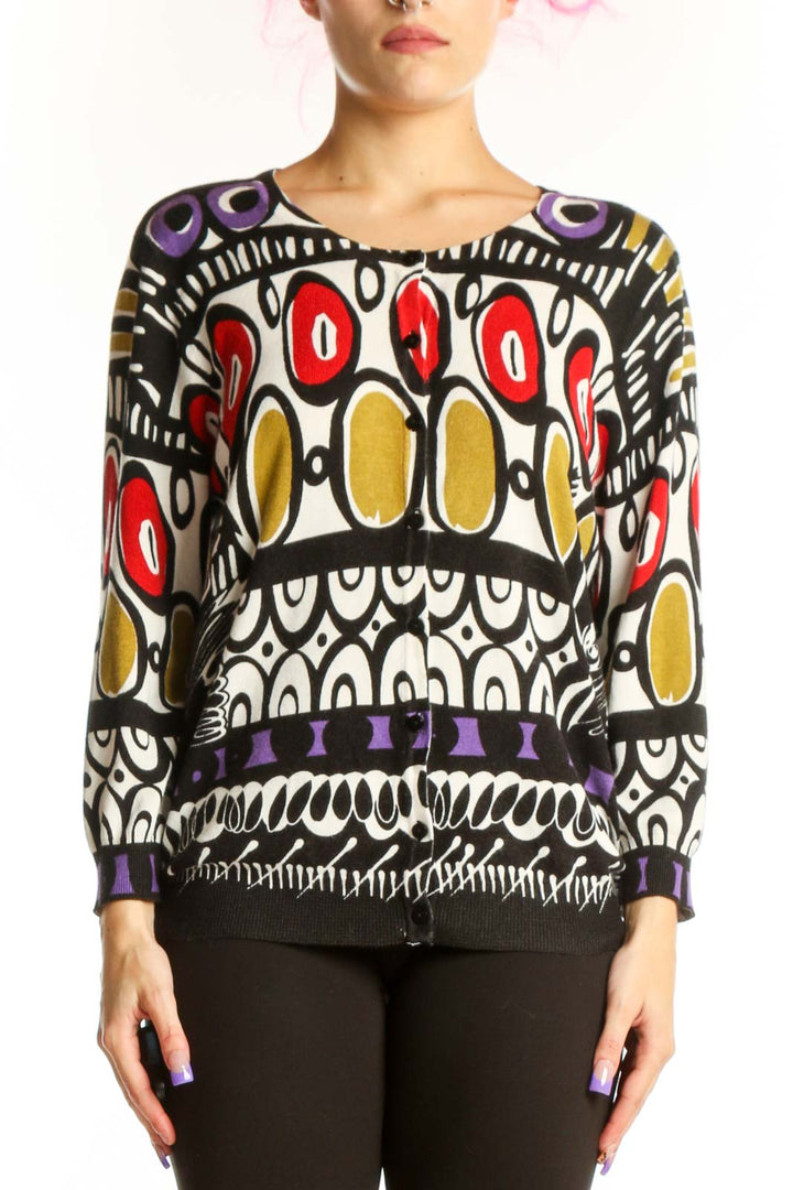 Front view of multicolor abstract geometric knit sweater by JOSEPH A. with vibrant red, gold, purple, and black interlocking circular patterns