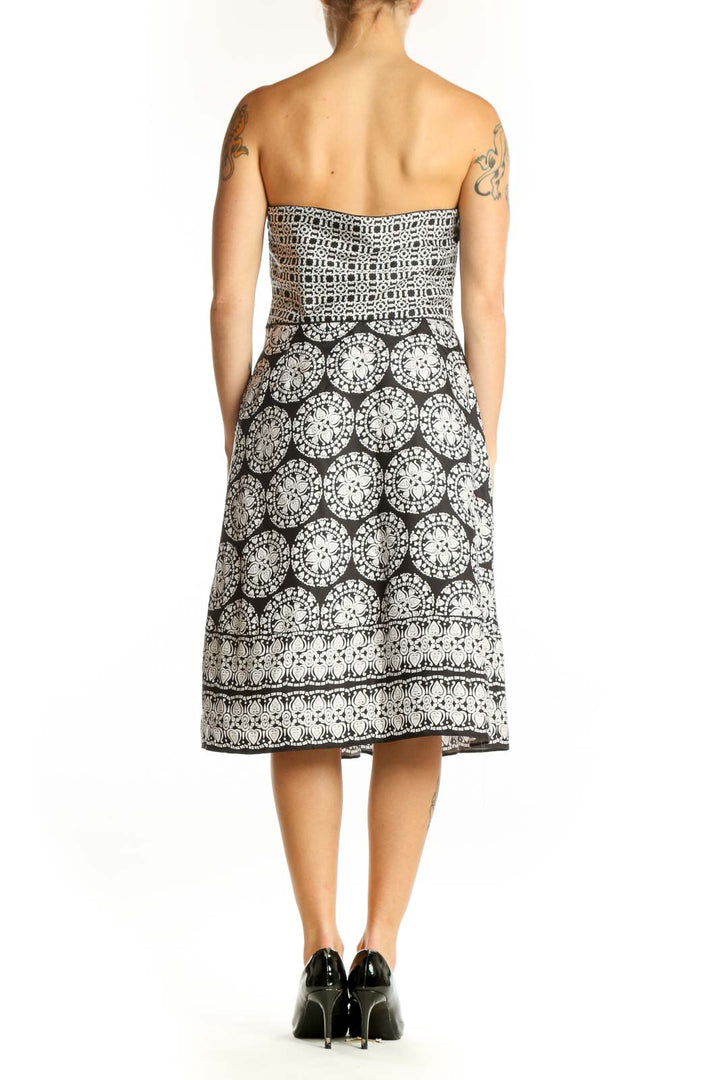 Side view of Black and White Geometric Strapless Dress showing pattern detail