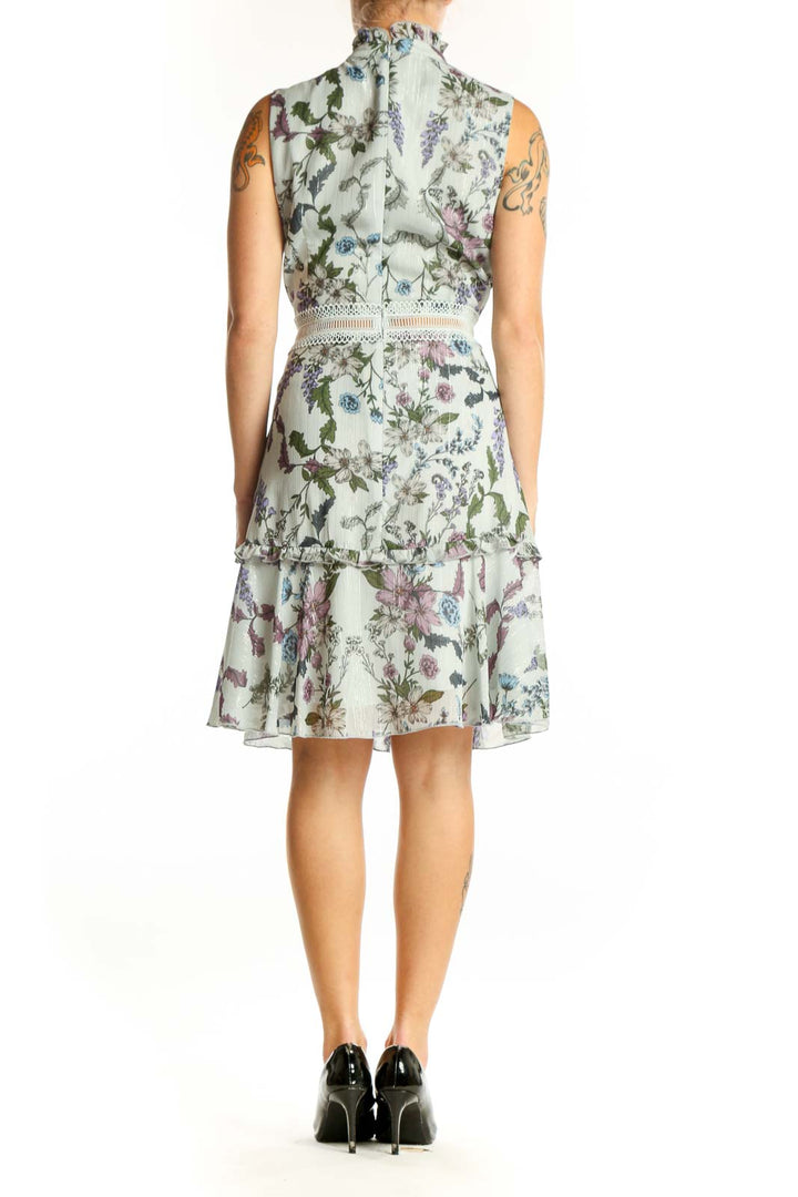 Side view of Donna Morgan mint floral sleeveless cocktail dress showing fitted silhouette
