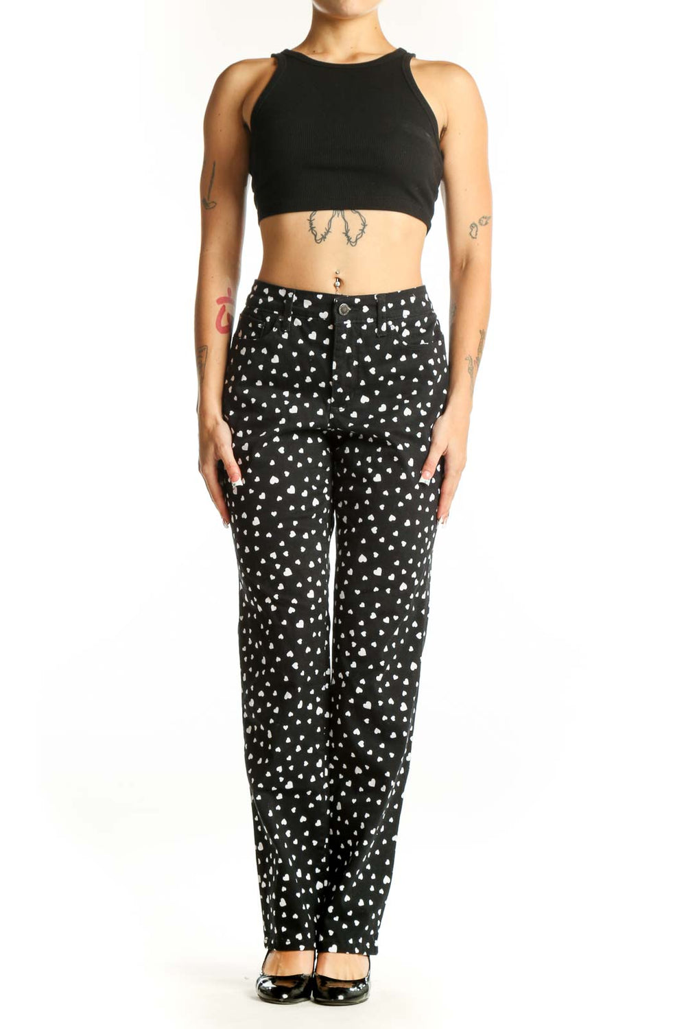 Front view of black straight-leg pants with white heart pattern