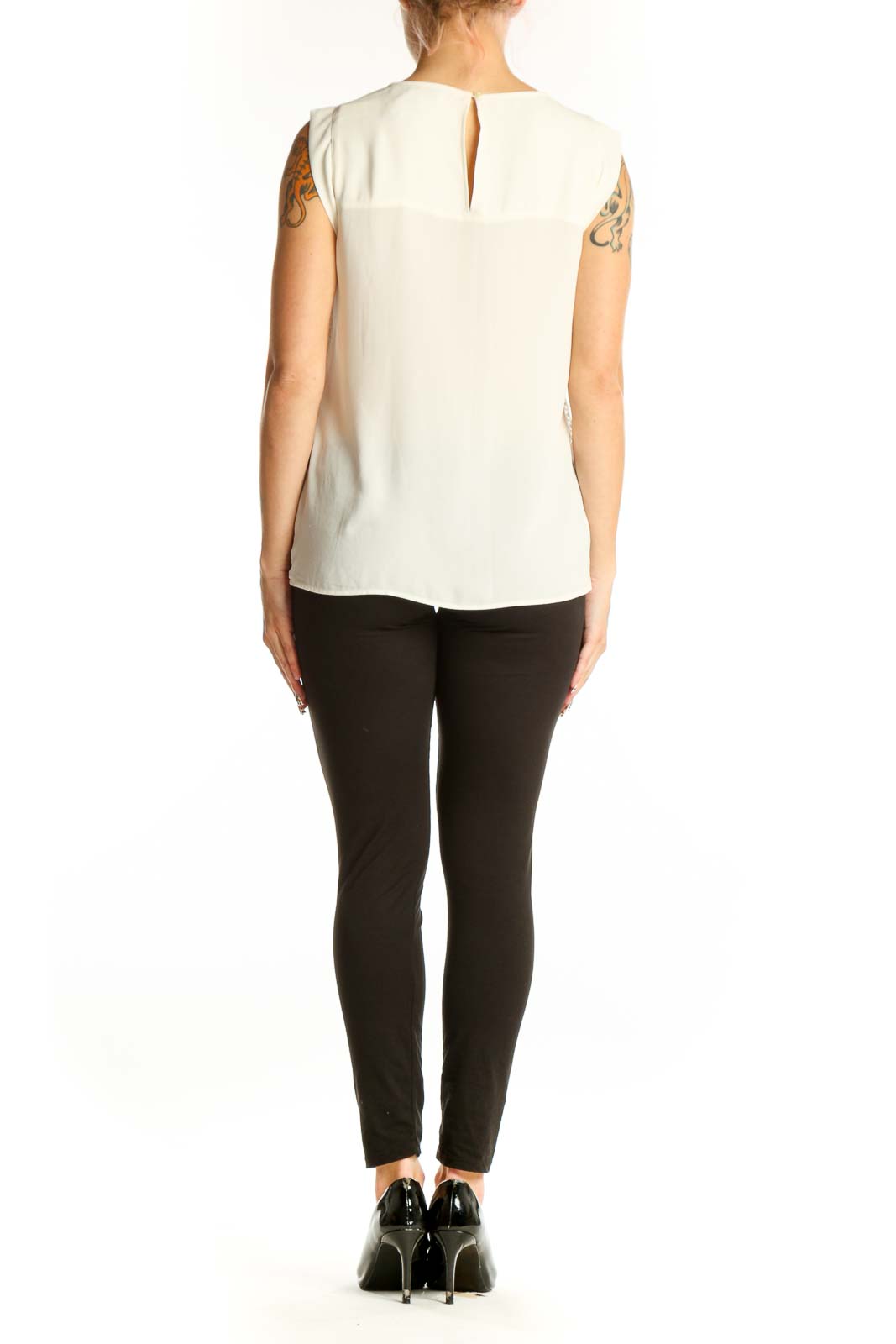 Side view of white lace overlay sleeveless blouse from LOFT on model