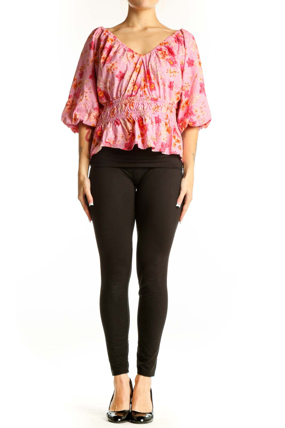 Front view of pink floral puff sleeve peplum top from LOFT