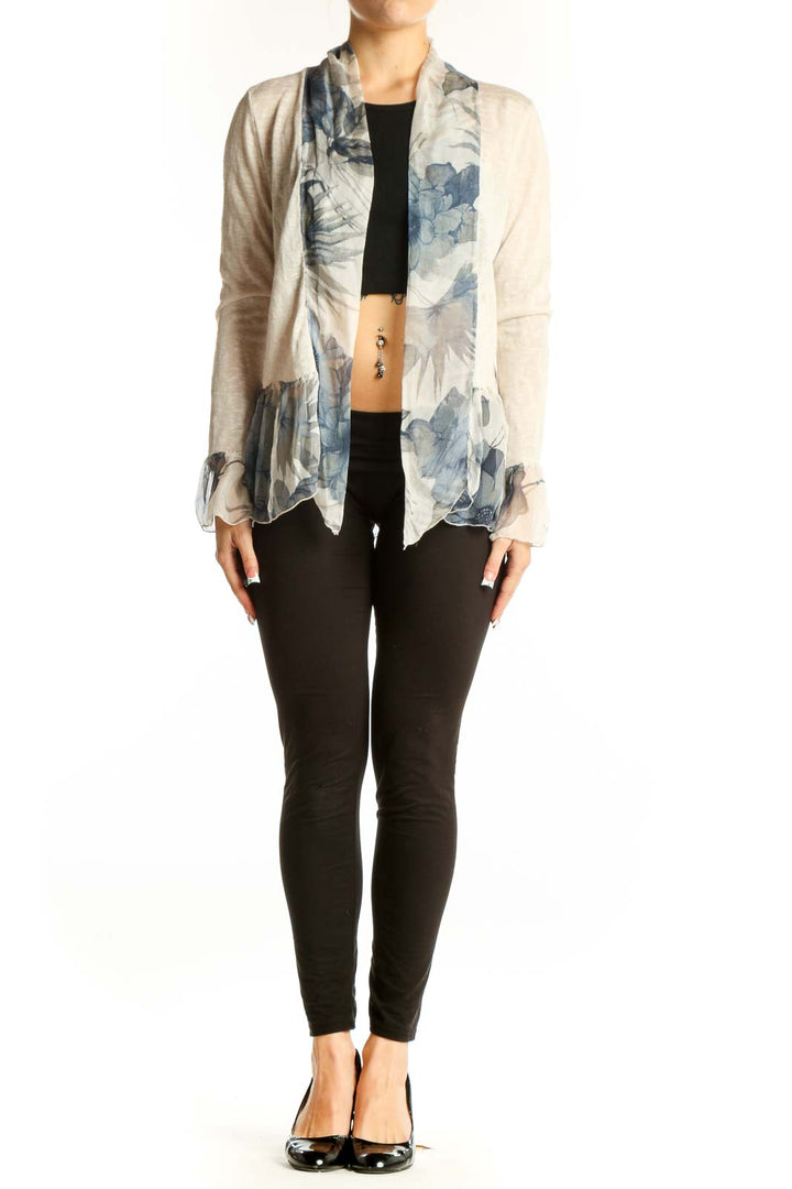 Front view of Elena Baldi beige knit cardigan with blue floral print