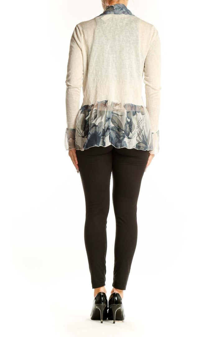 Side view of Elena Baldi beige knit cardigan showing floral print and silhouette