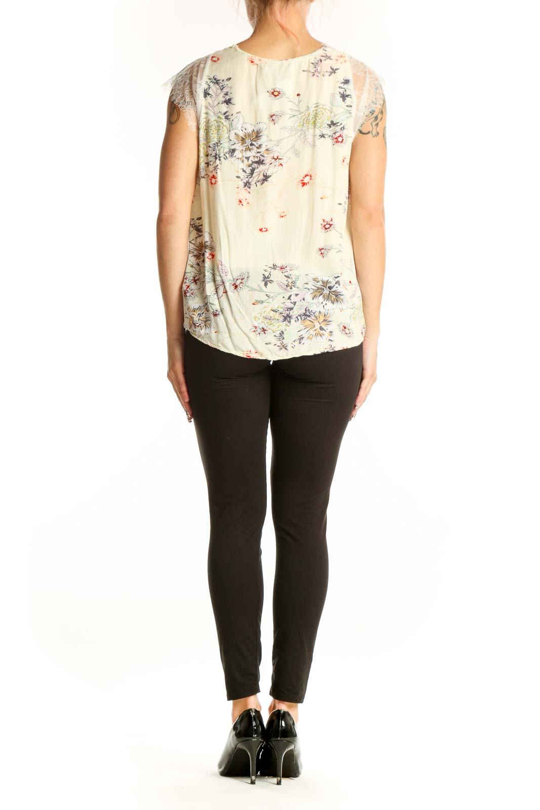 Side view of C+D+M cream floral sleeveless top on model