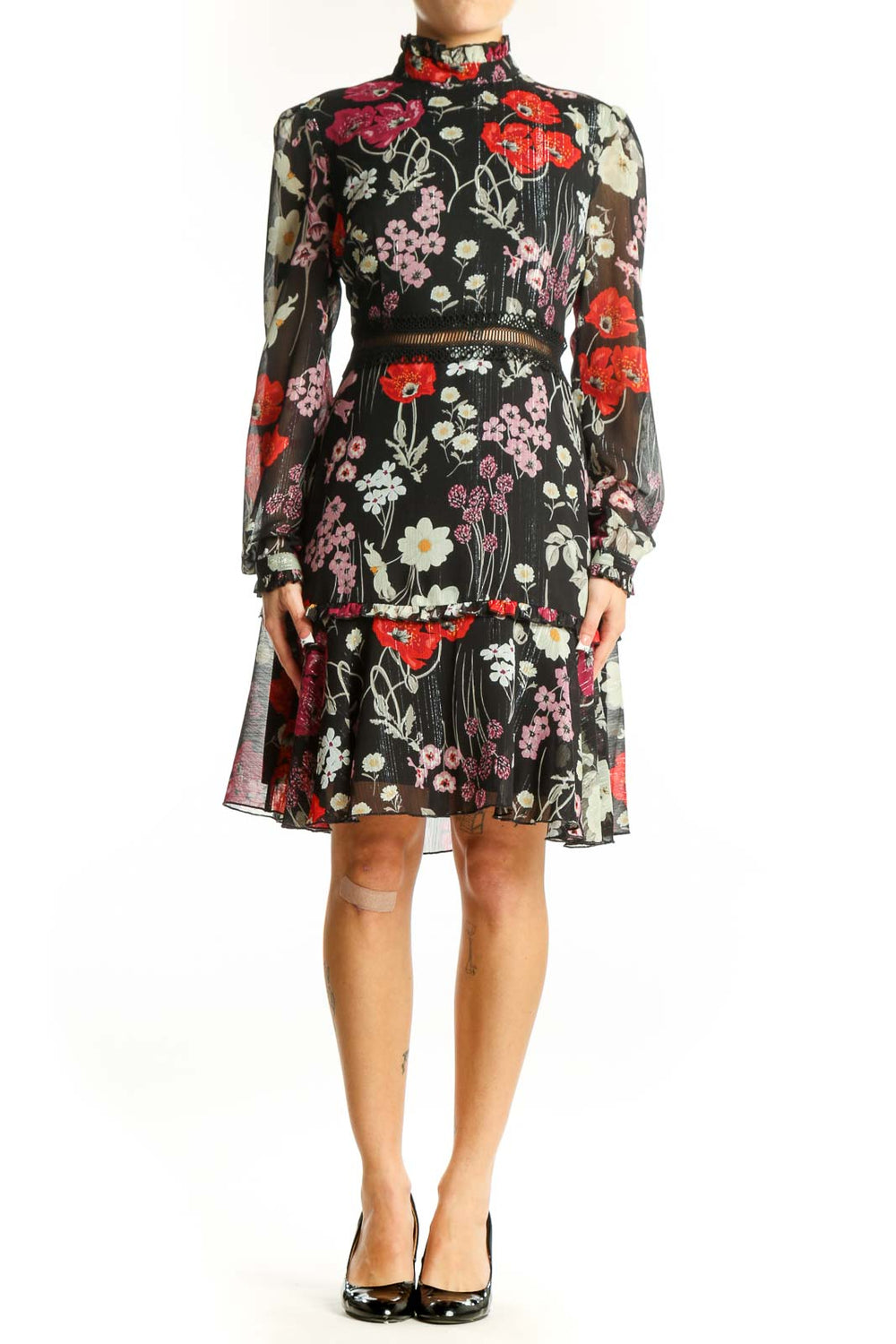 Front view of Donna Morgan black floral print chiffon cocktail dress with high neck and long sleeves