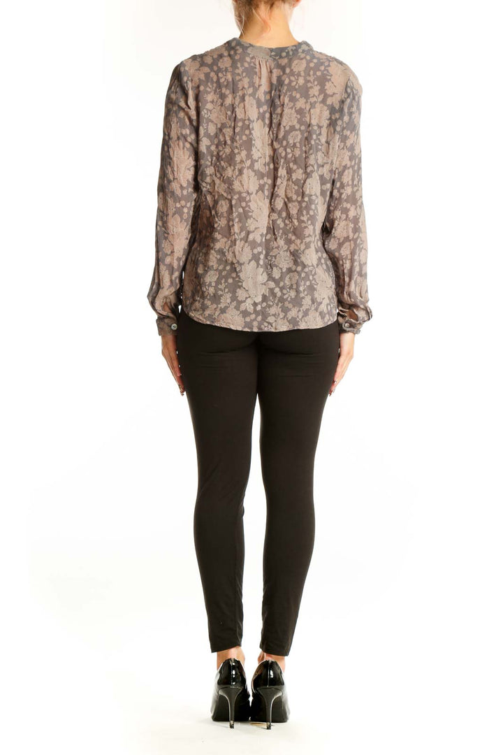 Side view of Chan Luu gray floral sheer blouse showing high-low hemline