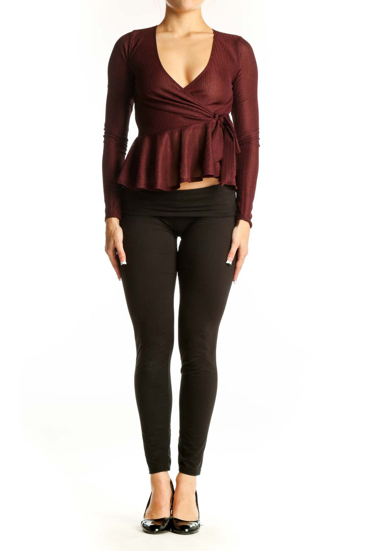 Front view of burgundy wrap peplum top with V-neckline and side tie